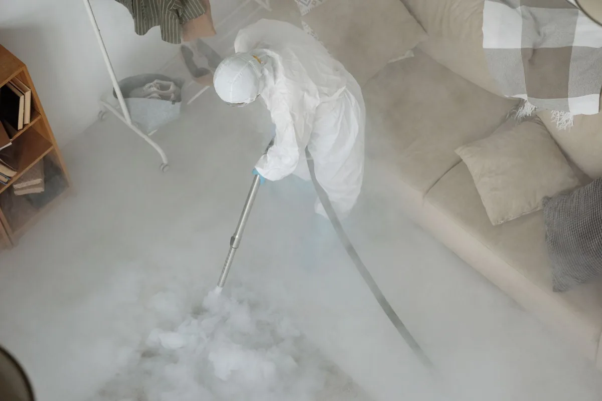 Biohazard cleanup technician in protective equipment, Frenchtown, MT